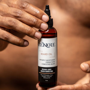 man holding zenore beard oil