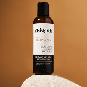 zenore beard wash sitting on rock