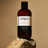 zenore daily hair moisturizer sitting on a rock